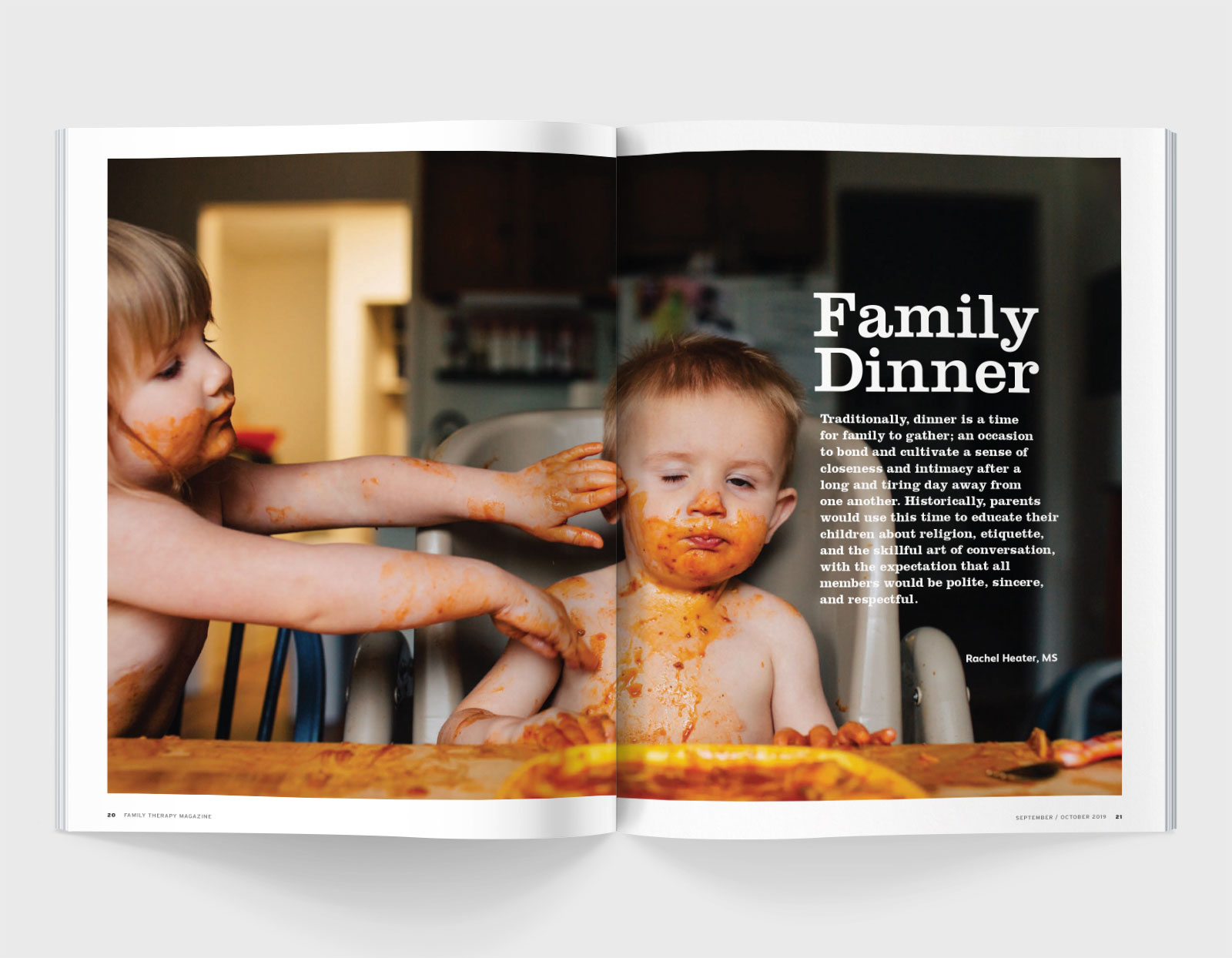 A spread of Family Therapy Magazine featuring two young toddlers covered in spaghetti sauce and text that reads 'Family Dinner'